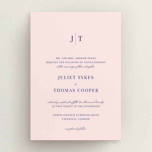 A wedding invite card design titled "Tradition in Pink". It is an A5 invite in a portrait orientation. "Tradition in Pink" is available as a flat invite, with mainly pink colouring.