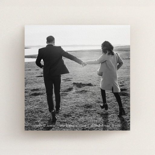 A wedding invite card named "Tradition with Photo". It is a square (148mm x 148mm) invite in a square orientation. It is a photographic wedding invite card with room for 1 photo. "Tradition with Photo" is available as a flat invite, with mainly white colouring.
