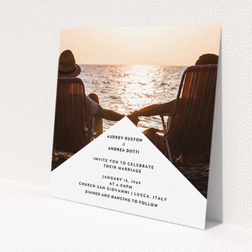 A wedding invite card design titled 'Triangle between us'. It is a square (148mm x 148mm) invite in a square orientation. It is a photographic wedding invite card with room for 1 photo. 'Triangle between us' is available as a flat invite, with mainly white colouring.