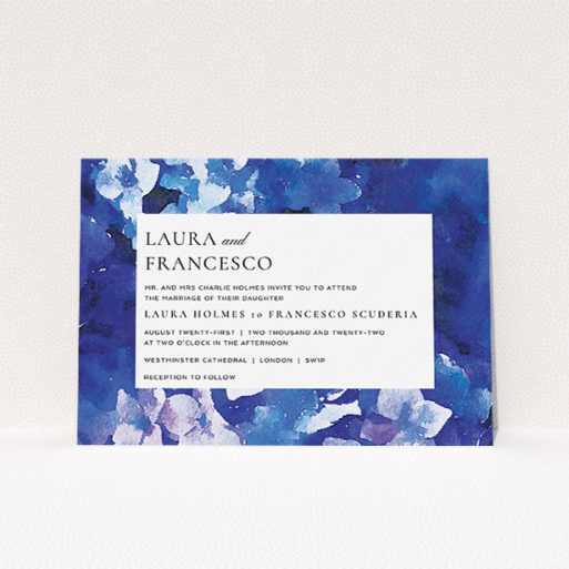 A wedding invite card called "Violets". It is an A5 invite in a landscape orientation. "Violets" is available as a flat invite, with tones of deep violet, light blue and light purple.