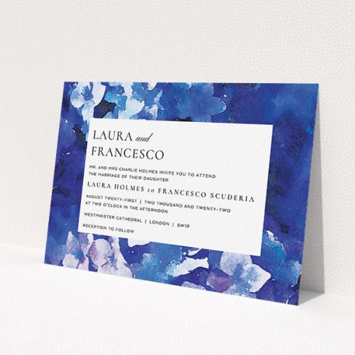 A wedding invite card called 'Violets'. It is an A5 invite in a landscape orientation. 'Violets' is available as a flat invite, with tones of deep violet, light blue and light purple.