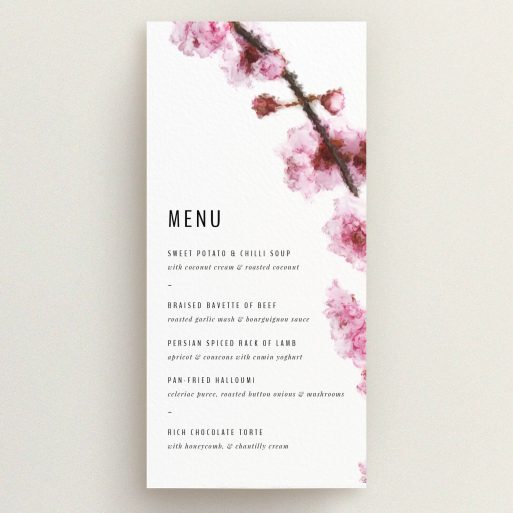 A wedding menu card design called "A side of Blossom". It is a tall (DL) menu in a portrait orientation. "A side of Blossom" is available as a flat menu, with tones of pink and white.