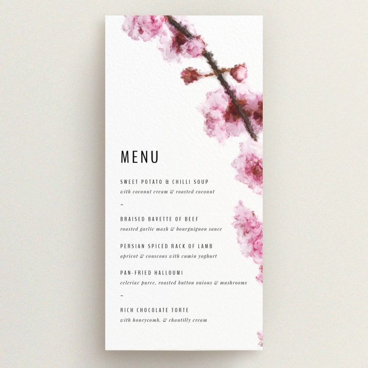 A wedding menu card design called "A side of Blossom". It is a tall (DL) menu in a portrait orientation. "A side of Blossom" is available as a flat menu, with tones of pink and white.
