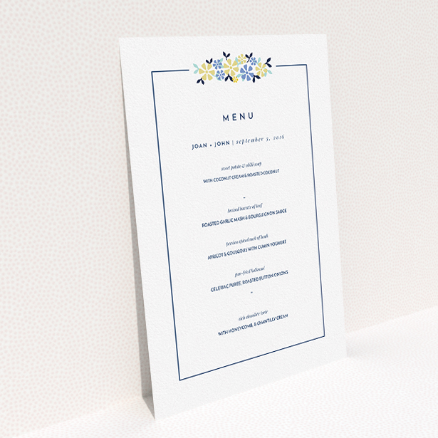 A wedding menu card design titled "In a border of flowers". It is an A5 menu in a portrait orientation. "In a border of flowers" is available as a flat menu, with tones of white and blue.