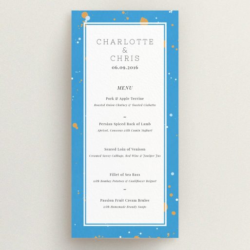 Wedding Menu Card Design - "Orange Splatters" A wedding menu card design titled "Orange Splatters". It is a tall (DL) menu in a portrait orientation. "Orange Splatters" is available as a flat menu, with tones of light blue and orange.