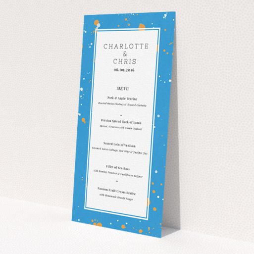 A wedding menu card design titled 'Orange Splatters'. It is a tall (DL) menu in a portrait orientation. 'Orange Splatters' is available as a flat menu, with tones of light blue and orange.