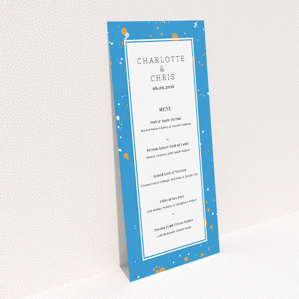 A wedding menu card design titled "Orange Splatters". It is a tall (DL) menu in a portrait orientation. "Orange Splatters" is available as a flat menu, with tones of light blue and orange.