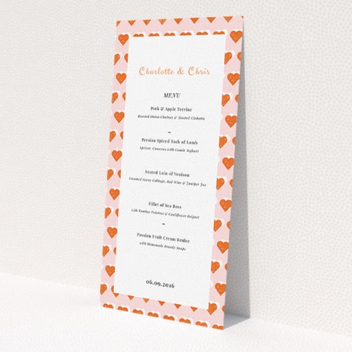 A wedding menu card named 'Rustic Hearts'. It is a tall (DL) menu in a portrait orientation. 'Rustic Hearts' is available as a flat menu, with tones of pink and orange.