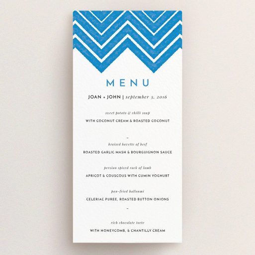 Wedding Menu Card Design - "Skiapthos" A wedding menu card design titled "Skiapthos". It is a tall (DL) menu in a portrait orientation. "Skiapthos" is available as a flat menu, with tones of blue and white.
