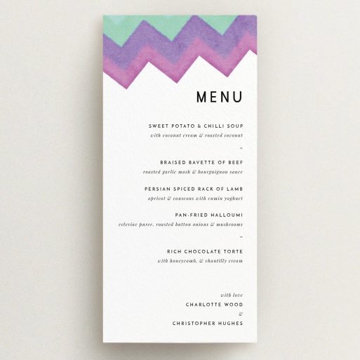 Wedding Menu Card Design - "Vibrant Peaks" A wedding menu card design named "Vibrant Peaks". It is a tall (DL) menu in a portrait orientation. "Vibrant Peaks" is available as a flat menu, with tones of white, green and purple.