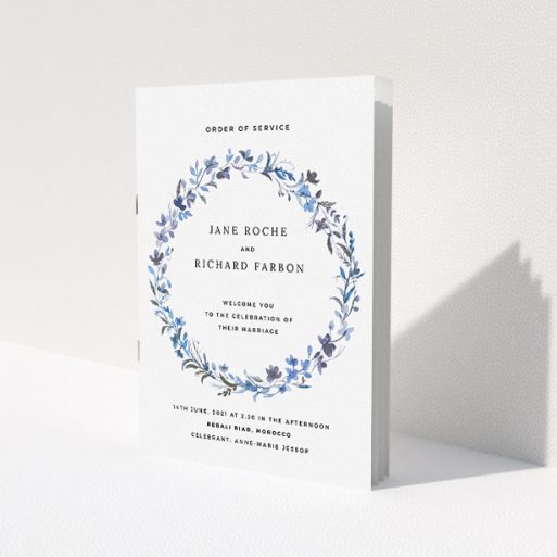 A wedding order of service design titled 'Blue Wildflower'. It is an A5 booklet in a portrait orientation. 'Blue Wildflower' is available as a folded booklet booklet, with tones of light blue, purple and grey.