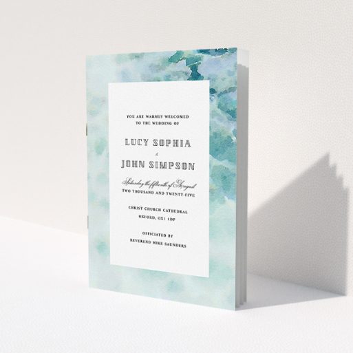 A wedding order of service design called 'Calm Waters Cover'. It is an A5 booklet in a portrait orientation. 'Calm Waters Cover' is available as a folded booklet booklet, with tones of blue and white.