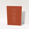 A wedding order of service named "Dark Ochre Monogrammed". It is an A5 booklet in a portrait orientation. "Dark Ochre Monogrammed" is available as a folded booklet booklet, with mainly dark orange colouring.