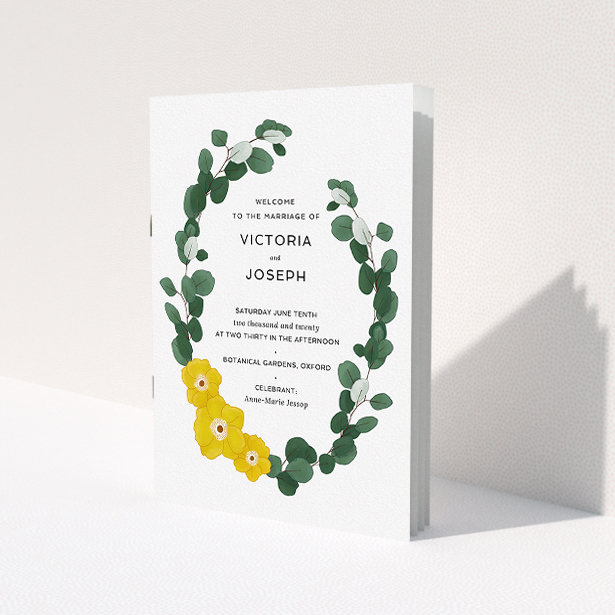 A wedding order of service design named "Eucalyptus Wreath". It is an A5 booklet in a portrait orientation. "Eucalyptus Wreath" is available as a folded booklet booklet, with tones of dark green and yellow.