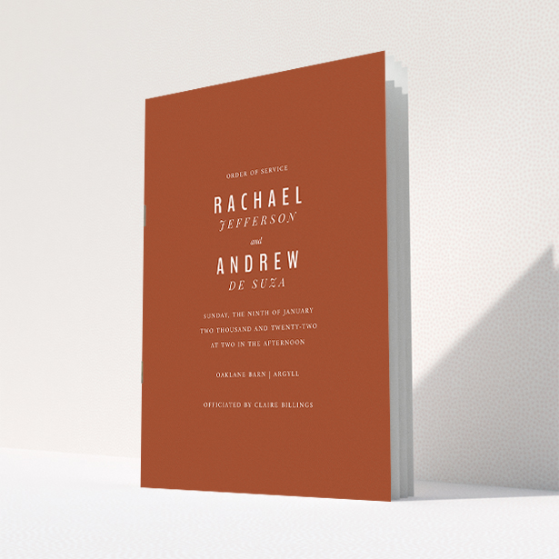 A wedding order of service named "Ochre with Typography". It is an A5 booklet in a portrait orientation. "Ochre with Typography" is available as a folded booklet booklet, with mainly dark orange colouring.