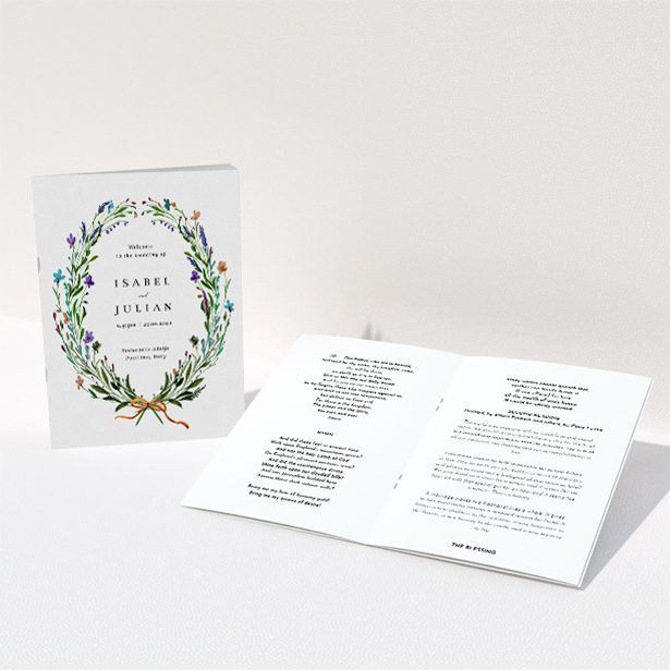 A wedding order of service named "Spring Wildflower Wreath". It is an A5 booklet in a portrait orientation. "Spring Wildflower Wreath" is available as a folded booklet booklet, with tones of green and purple.