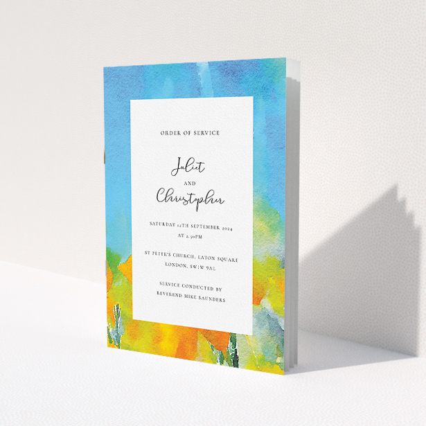 A wedding order of service called "Summer Watercolours". It is an A5 booklet in a portrait orientation. "Summer Watercolours" is available as a folded booklet booklet, with tones of yellow, blue and green.