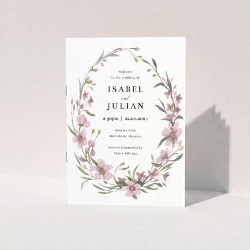 A wedding order of service design called "True Watercolour Cover". It is an A5 booklet in a portrait orientation. "True Watercolour Cover" is available as a folded booklet booklet, with tones of faded pink and autumnal green.