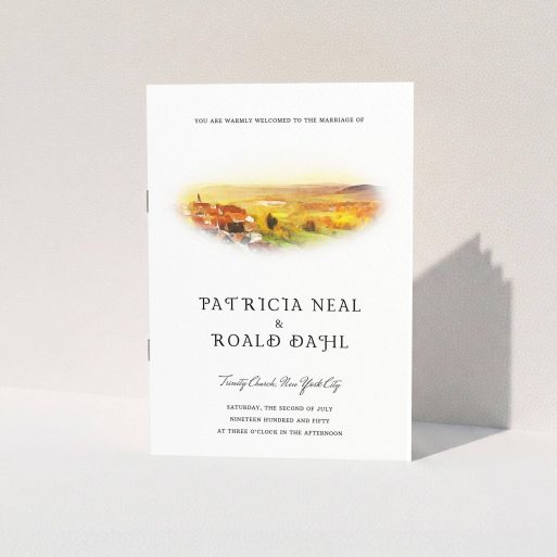 A wedding order of service design named "Village Window". It is an A5 booklet in a portrait orientation. "Village Window" is available as a folded booklet booklet, with tones of yellow, orange and brown.