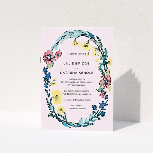 A wedding order of service design called "Vintage Floral". It is an A5 booklet in a portrait orientation. "Vintage Floral" is available as a folded booklet booklet, with tones of light pink and red.
