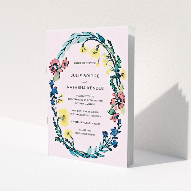 A wedding order of service design called "Vintage Floral". It is an A5 booklet in a portrait orientation. "Vintage Floral" is available as a folded booklet booklet, with tones of light pink and red.