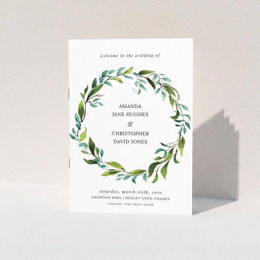 A wedding order of service design named "Watercolour Wreath Cover". It is an A5 booklet in a portrait orientation. "Watercolour Wreath Cover" is available as a folded booklet booklet, with tones of green and light blue.