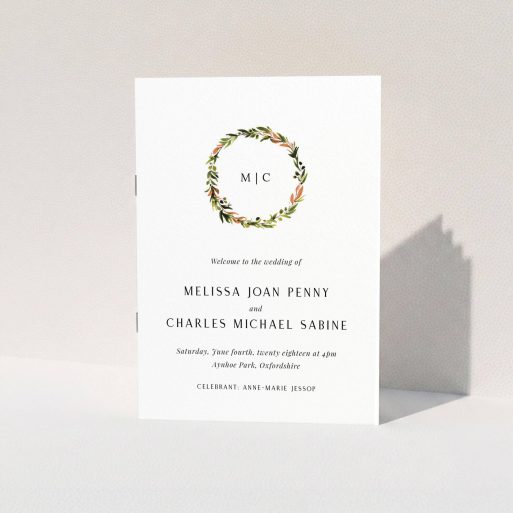 A wedding program named "Floral Monogram". It is an A5 booklet in a portrait orientation. "Floral Monogram" is available as a folded booklet booklet, with tones of white and Orange.