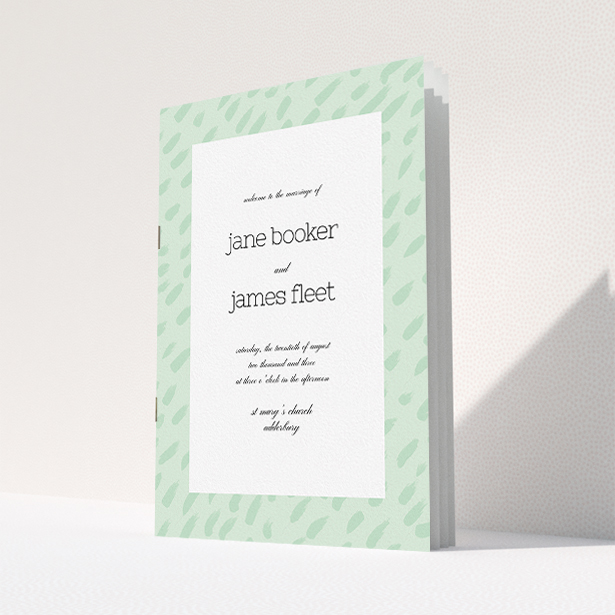 A wedding program design called "Green Strokes". It is an A5 booklet in a portrait orientation. "Green Strokes" is available as a folded booklet booklet, with tones of green and white.