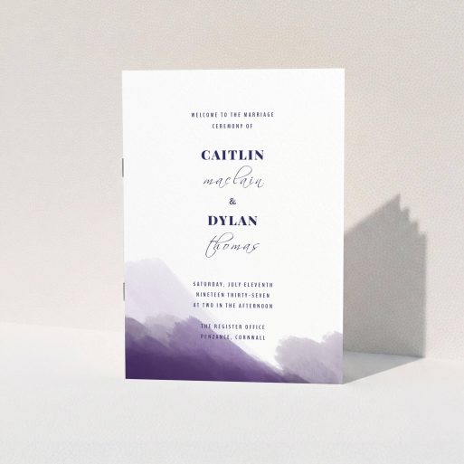 A wedding program named "Purple halftone". It is an A5 booklet in a portrait orientation. "Purple halftone" is available as a folded booklet booklet, with mainly dark blue colouring.