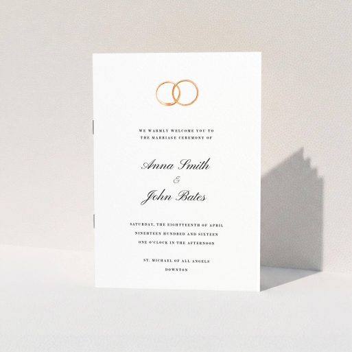 A wedding program called "The newlyweds". It is an A5 booklet in a portrait orientation. "The newlyweds" is available as a folded booklet booklet, with tones of white and gold.