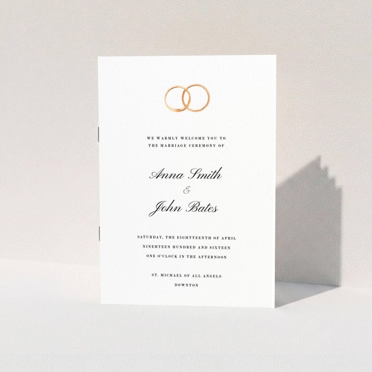 A wedding program called "The newlyweds". It is an A5 booklet in a portrait orientation. "The newlyweds" is available as a folded booklet booklet, with tones of white and gold.