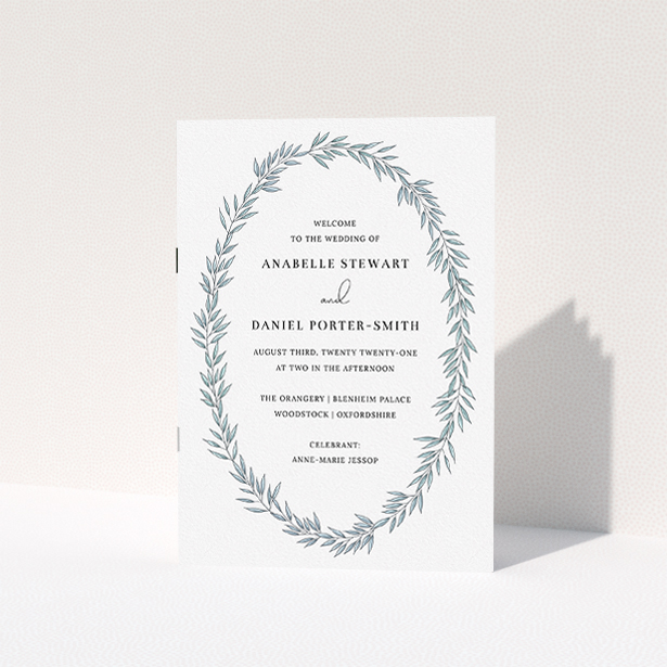 A wedding program named "Tussled Wreath". It is an A5 booklet in a portrait orientation. "Tussled Wreath" is available as a folded booklet booklet, with tones of blue and white.