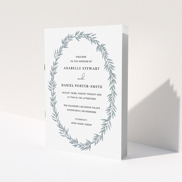 A wedding program named 'Tussled Wreath'. It is an A5 booklet in a portrait orientation. 'Tussled Wreath' is available as a folded booklet booklet, with tones of blue and white.