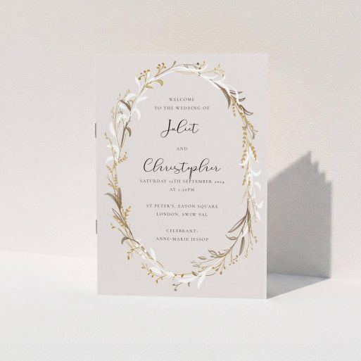 A wedding program named "Winter Wedding Order of Service". It is an A5 booklet in a portrait orientation. "Winter Wedding Order of Service" is available as a folded booklet booklet, with tones of dark cream and gold.