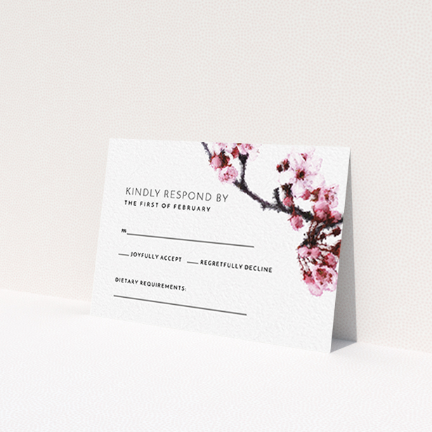 A wedding response card design called "A side of Blossom". It is an A7 card in a landscape orientation. "A side of Blossom" is available as a flat card, with tones of pink and white.