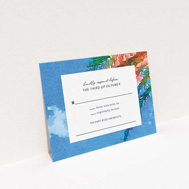 A wedding response card design called "From the Sunbed". It is an A7 card in a landscape orientation. "From the Sunbed" is available as a flat card, with tones of sky blue and green.