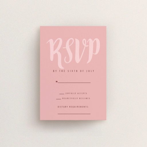 Wedding Response Card Design - "Pastel Pink Typography" A wedding response card called "Pastel Pink Typography". It is an A7 card in a portrait orientation. "Pastel Pink Typography" is available as a flat card, with mainly pink colouring.