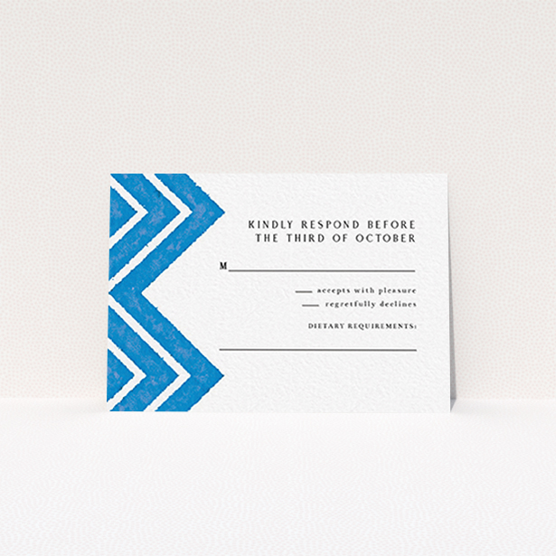 A wedding response card template titled "Skiapthos". It is an A7 card in a landscape orientation. "Skiapthos" is available as a flat card, with tones of blue and white.