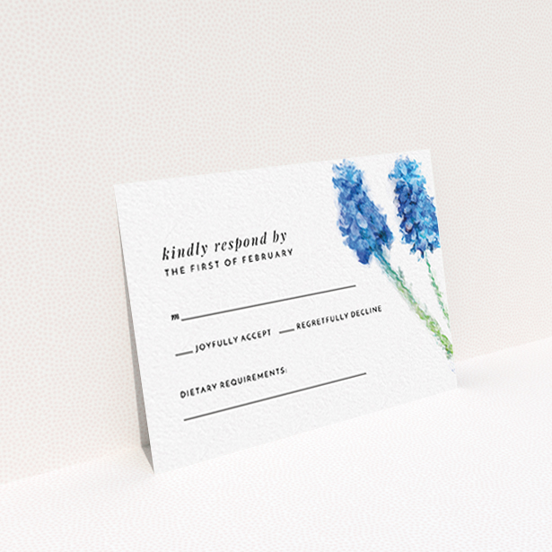 A wedding rsvp card design named "A new bloom". It is an A7 card in a landscape orientation. "A new bloom" is available as a flat card, with tones of blue and white.
