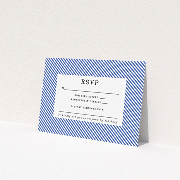 A wedding rsvp card template titled "Between the Lines". It is an A7 card in a landscape orientation. "Between the Lines" is available as a flat card, with tones of blue and white.