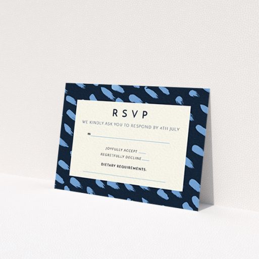 A wedding rsvp card design named 'Blue strokes'. It is an A7 card in a landscape orientation. 'Blue strokes' is available as a flat card, with tones of dark blue and light blue.