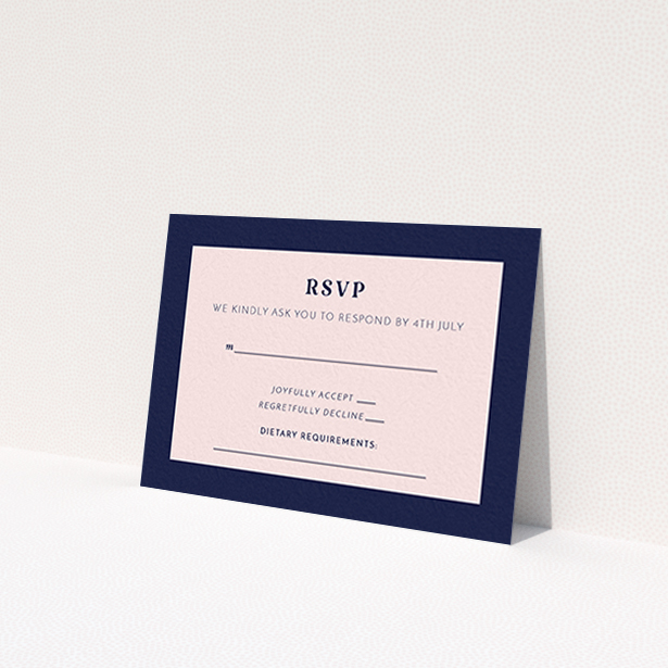 A wedding rsvp card called "Bold border". It is an A7 card in a landscape orientation. "Bold border" is available as a flat card, with tones of navy blue and pink.