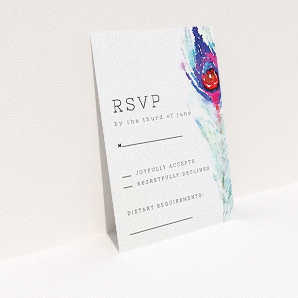 A wedding rsvp card design titled "Feather in the corner". It is an A7 card in a portrait orientation. "Feather in the corner" is available as a flat card, with tones of off-white and deep purple.