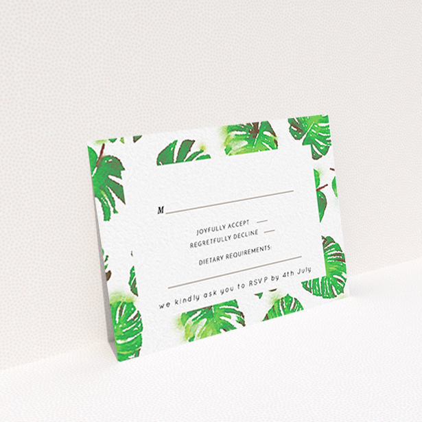 A wedding rsvp card design titled "Jungle Sky". It is an A7 card in a landscape orientation. "Jungle Sky" is available as a flat card, with tones of green and white.