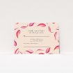 A wedding rsvp card named "Petal avalanche". It is an A7 card in a landscape orientation. "Petal avalanche" is available as a flat card, with tones of pink, red and white.