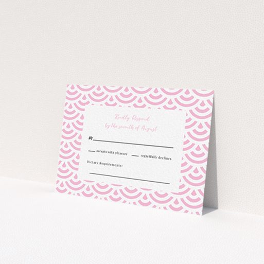 A wedding rsvp card named 'Pink Fans'. It is an A7 card in a landscape orientation. 'Pink Fans' is available as a flat card, with tones of pink and white.