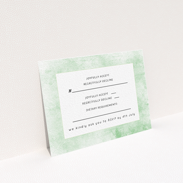 A wedding rsvp card named "Rustic Green". It is an A7 card in a landscape orientation. "Rustic Green" is available as a flat card, with tones of green and white.