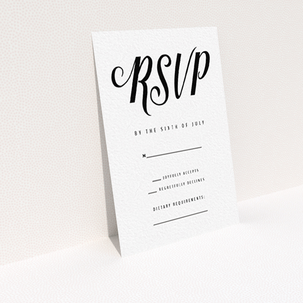 A wedding rsvp card named "Slant Typography Black". It is an A7 card in a portrait orientation. "Slant Typography Black" is available as a flat card, with tones of black and white.
