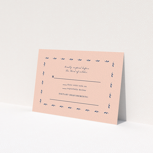 A wedding rsvp card named 'Swimming in the garden'. It is an A7 card in a landscape orientation. 'Swimming in the garden' is available as a flat card, with tones of dark pink and blue.