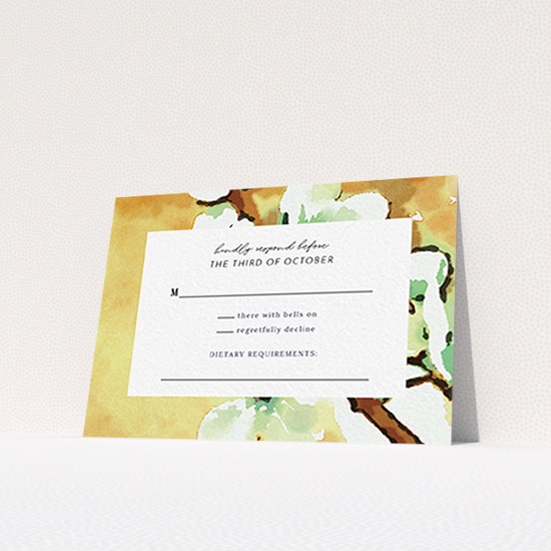 A wedding rsvp card design named "Vintage Blossom". It is an A7 card in a landscape orientation. "Vintage Blossom" is available as a flat card, with tones of deep orange, mint green and white.